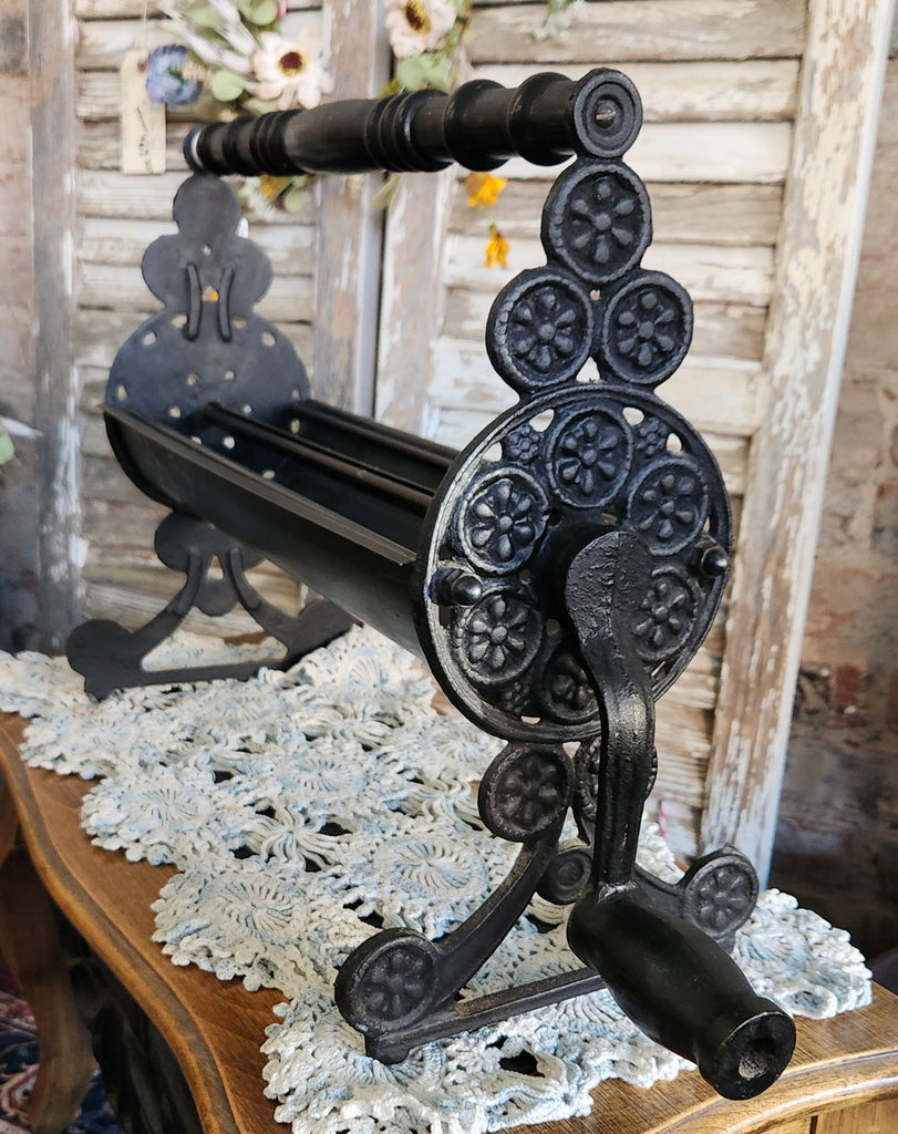 Vintage Cast Iron Newspaper Log Roller